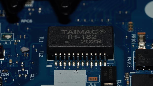 a close up of a motherboard with a small electronic device photo