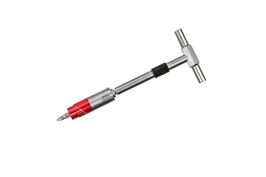 Screwdriver with reversible mechanism and magnetic holder of replaceable nozzles. A set of nozzles. Tools for construction and repair shop. Isolate on a white back. photo