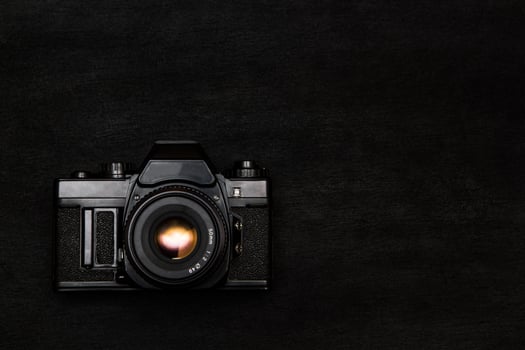 vintage camera on a black photo