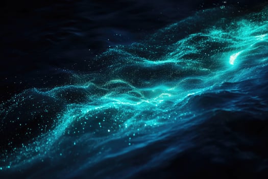 Bioluminescent plankton glow brilliantly in the dark. photo