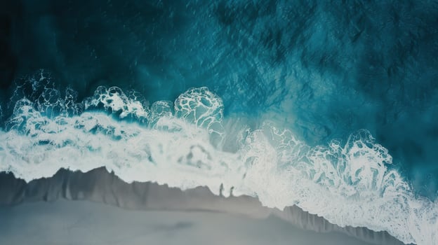 Serene Aerial View of Turquoise Waves Along Rugged Coastline in Daylight photo