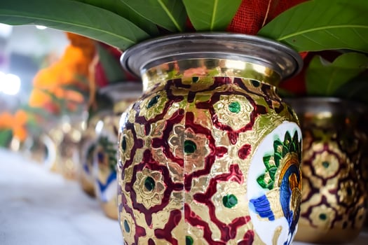 Kalash with coconut and mango leaf with floral decoration earthen pots containing sacred water. Kalash for hindu puja during Jagannath Temple Mangal Kalash Yatra, front view, closeup photo