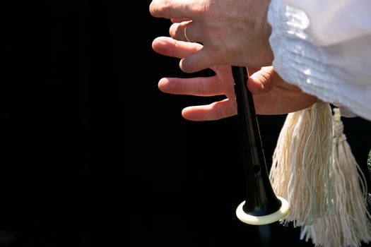 fingers of a bagpipe player playing the bagpipes in Galicia, folk music concept photo