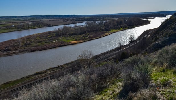 Valley with a slowly flowing river, glare of the sun. Montana nature photo