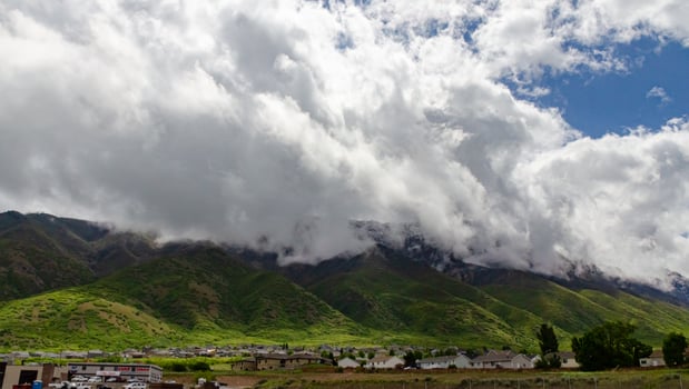 Forested mountains covered with low hanging clouds, US photo