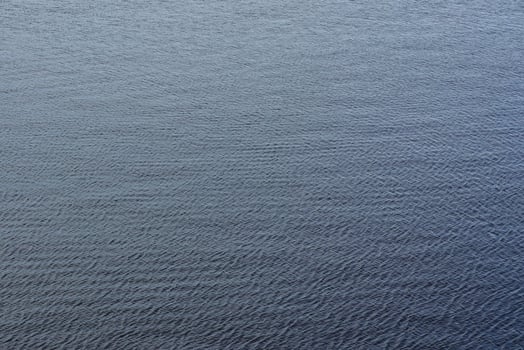 The texture of ripples on the water. Natural background. photo