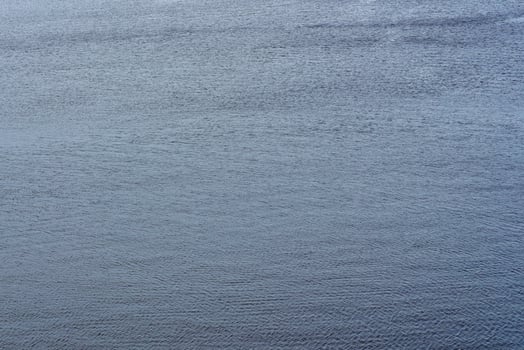 The texture of ripples on the water. Natural background. photo