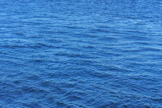 The texture of ripples on the water. Natural background. photo