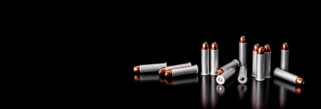 Bullet isolated on black background with reflexion. Rifle bullets close-up on black back. Cartridges for rifle and carbine on a black. photo