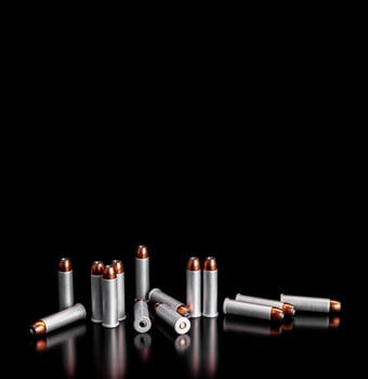 Bullet isolated on black background with reflexion. Rifle bullets close-up on black back. Cartridges for rifle and carbine on a black. photo