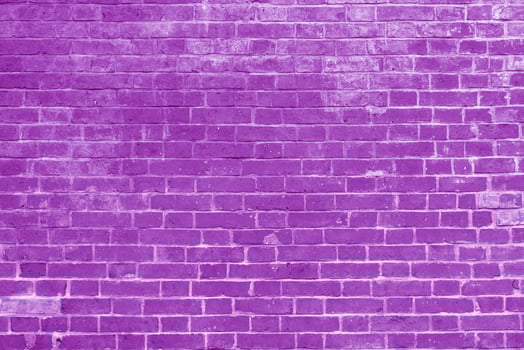 Pink brick wall. Interior of a modern loft. Background for photo and filming. The facade of a brick building.