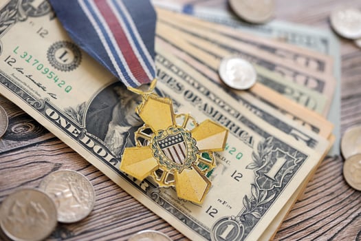 KYIV, UKRAINE - JULY 10, 2024 The Coast Guard Cross medal. United States military award medal with ribbon and pin. Handmade paper theater props photo