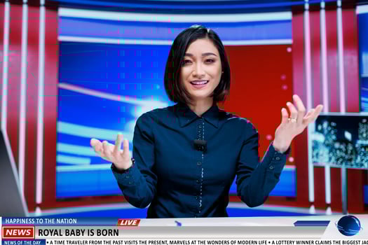 Journalist gives royal family update live on television channel, presenting latest events about new born baby of the monarchy. Woman media presenter makes announcement in news studio. photo