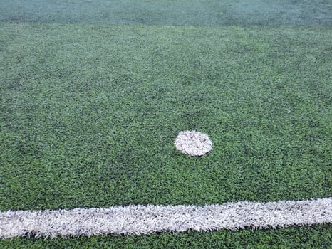 Turf and penalty kick positions on football fields photo