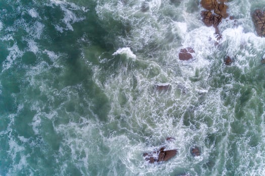 drone view of the seashore with rough seas on a rocky shore photo