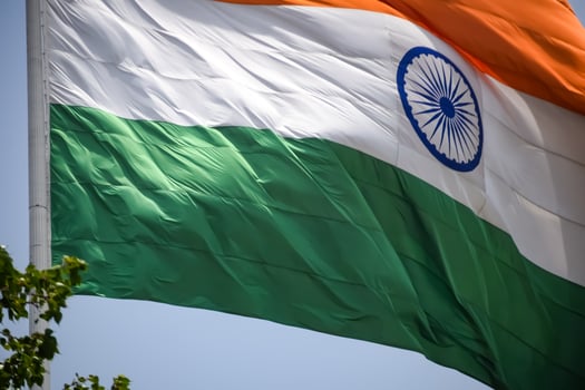 India flag flying high at Connaught Place with pride in blue sky, India flag fluttering, Indian Flag on Independence Day and Republic Day of India, tilt up shot, Waving Indian flag, Har Ghar Tiranga photo