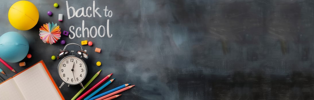 Back To School Supplies On Blackboard With Clock And Colorful Stationery photo