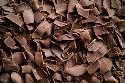 A textured layer of shredded chocolate forms a rich, indulgent background. photo