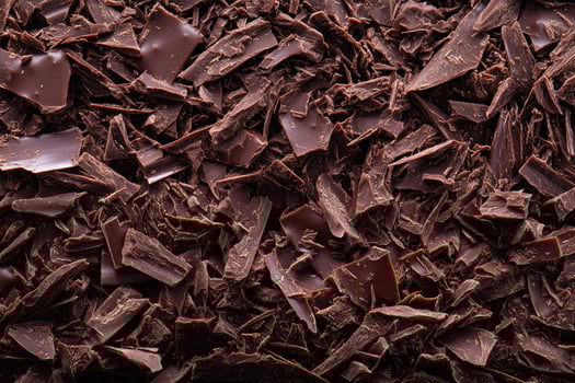 A textured layer of shredded chocolate forms a rich, indulgent background. photo