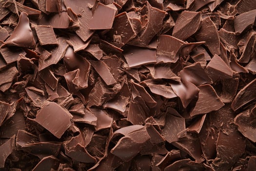 A textured layer of shredded chocolate forms a rich, indulgent background. photo