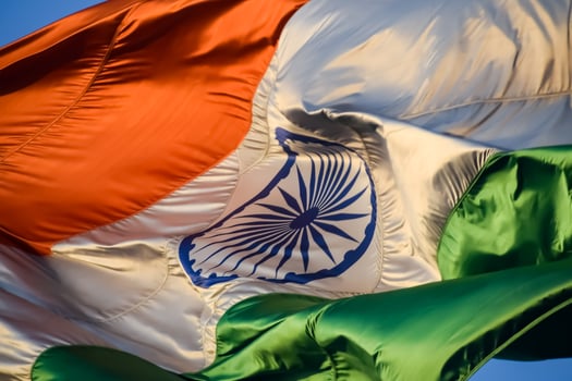 India flag flying high at Connaught Place with pride in blue sky, India flag fluttering, Indian Flag on Independence Day and Republic Day of India, tilt up shot, Waving Indian flag, Har Ghar Tiranga photo