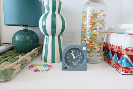 Stylish Home Dcor with Colorful Accessories and Vintage Clock photo