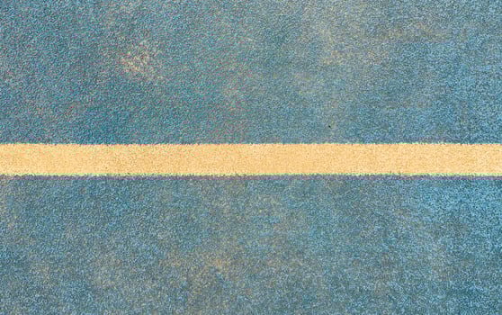 white line on a blue paddle tennis court. photo