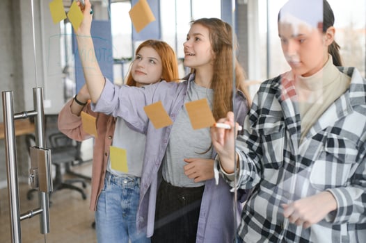 students discuss university assignments together photo