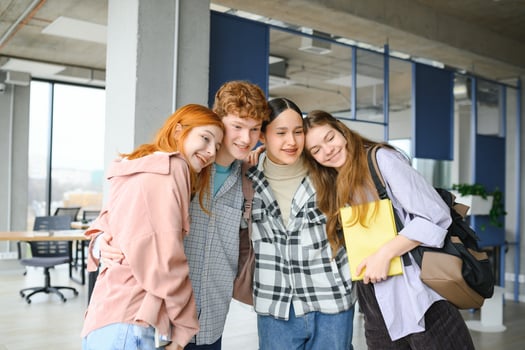Happy diverse college students posing for group portrait, looking at camera, smiling photo