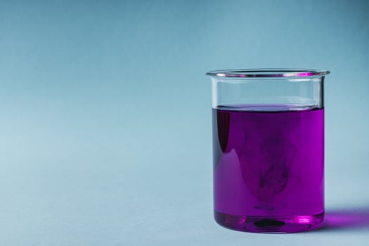 potassium permanganate solution on a blue background photo