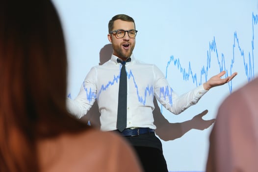 Portrait of concerned European businessman thinking in blurry office with double exposure of falling financial chart. Concept of crisis and stock market. photo
