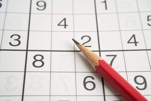 Sudoku puzzle game playing to challenge brain. photo