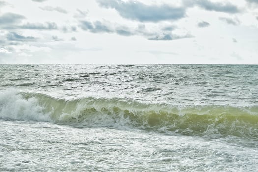 Big waves in the sea. Beautiful sea with splashes under the bright morning sunlight. photo