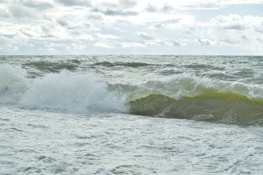 Big waves in the sea. Beautiful sea with splashes under the bright morning sunlight. photo