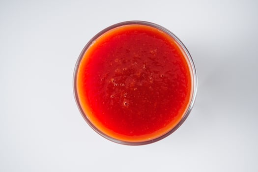 fresh tasty natural tomato juice on a white background photo