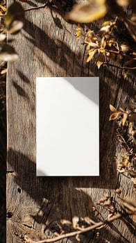6x9 size white greeting card mockup, top view, weathered wooden table, scenic light photo