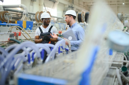 Two workers at the factory. Engineer and worker photo