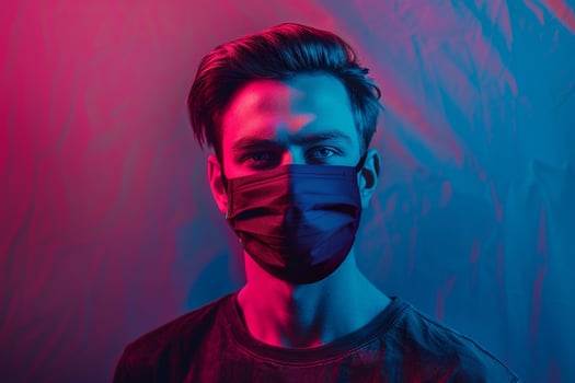 Contemporary Fashion Male Model in Maroon Face Mask with Neon Blue Background Trendy Lifestyle portrait photo