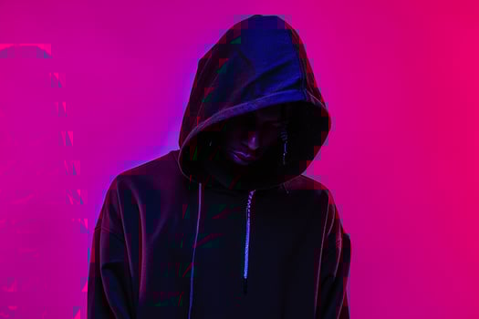 Fashion Forward Male Model in Black Hoodie with Neon purple Captured in a Modern Lifestyle portrait Setting photo