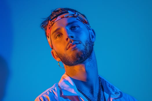 Handsome Male Model in Casual Bandana with Neon Blue Trendy portrait with Urban Lifestyle Background photo
