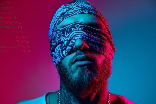 Stylish Male Model in Casual Bandana with Neon Blue Modern portrait with Urban Background photo
