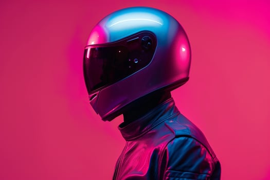 Fashion Male Model in Silver Fashion Helmet with Neon pink Background Trendsetting Urban portrait with Chic Neon pink Vibe photo