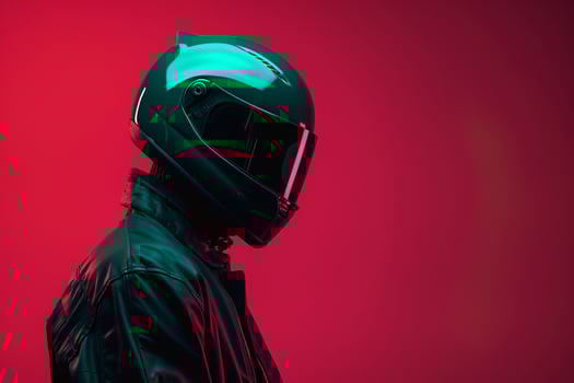 Handsome Fashion Male Model in Dark Green Fashion Helmet with Neon Coral Background Trendy and Modern Lifestyle portrait for Males Fashion photo