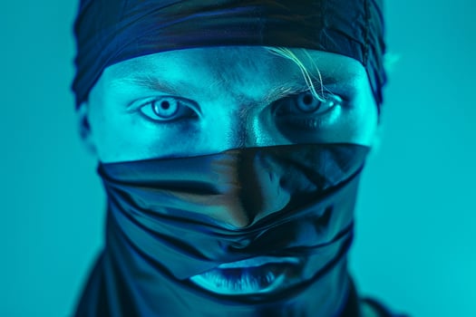 Fashion Male Model in Matte Black Bandana with Neon Teal Background Trendy Lifestyle portrait for Males Fashion photo