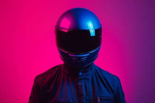 Trendy Fashion Male Model in Dark Blue Fashion Helmet with Neon pink Background Chic Lifestyle portrait for Males Fashion photo