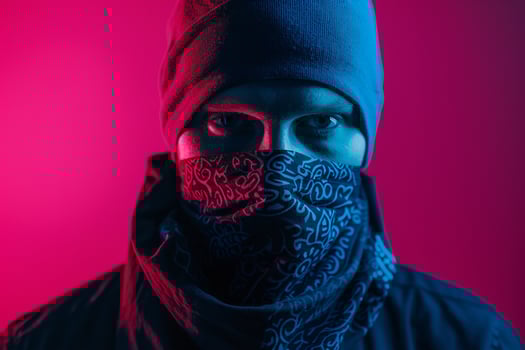 Trendy Fashion Male Model in Dark Teal Bandana with Neon pink Background Chic Lifestyle portrait for Males Fashion photo