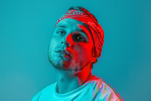 Fashionable Handsome Male Model in Neon Red Bandana with Neon Aqua Details Set Against a Vibrant Neon Lifestyle Background Modern Males portrait photo