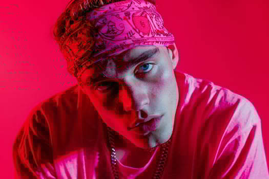Fashionable Male Model in Bright pink Bandana with Neon Red Background Dynamic Urban portrait Showcasing Modern Fashion photo