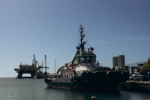 Canary Islands, Tenerife-December 19,2023. Tugboat after mooring operation in port of Santa Cruz de Tenerife photo