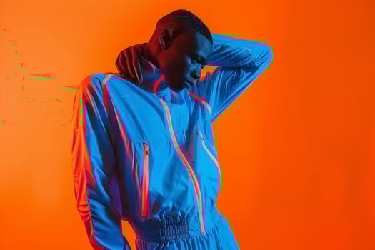 Male Fashion ModelTrendy Tracksuit withNeon Orange Lifestyle Males portrait Fashion Male Background photo